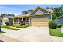 Inviting home with an attached garage and meticulous landscaping at 221 Aster Ct, Canton, GA 30114