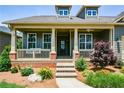 Charming porch with a swing and beautiful landscaping, perfect for relaxing outdoors at 221 Aster Ct, Canton, GA 30114