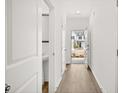 Light-filled entryway with view to front door and powder room at 281 Kenoot Dr # 36, Mcdonough, GA 30253