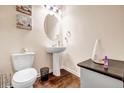 Powder room with pedestal sink and toilet at 11119 Torino Dr, Hampton, GA 30228