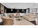 Elegant living room features a cozy fireplace, dark accent wall, and sophisticated decor at 54 Basswood Cir, Atlanta, GA 30328