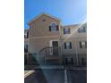 Brick townhouse exterior with stairs and a small patio at 3974 Stillwater Dr, Duluth, GA 30096
