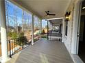 A spacious porch features a ceiling fan, and sturdy columns provide an inviting outdoor space at 500 Chiswick Cir # 11, Alpharetta, GA 30009