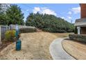 Community dog park with a waste station and walking path for residents and their furry friends to enjoy at 3058 Turman Cir, Decatur, GA 30033