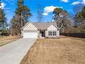 Charming single-Gathering home with a two-car garage and a well-manicured lawn in a quiet neighborhood at 45 3Rd E Ave, Dallas, GA 30157