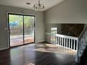 Bright dining room with hardwood floors and sliding glass doors to a patio or deck at 683 Wood Path Ct, Stone Mountain, GA 30083