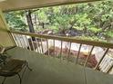 Balcony view overlooking lush greenery and a serene outdoor space at 738 Brentwood Pl, Marietta, GA 30067