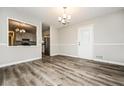 Comfortable dining room featuring hardwood floors and white trim provides an inviting space for meals and gatherings at 1005 Quail Dr, Stockbridge, GA 30281