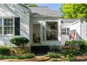 Inviting front porch with glass door, and welcoming decor at 5154 Central Dr, Stone Mountain, GA 30083