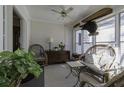 Relaxing screened porch with wicker furniture and ceiling fan at 5154 Central Dr, Stone Mountain, GA 30083