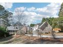 Beautiful brick home with attached garages and mature trees in a lovely neighborhood at 3930 Peachtree Dunwoody Ne Rd, Atlanta, GA 30342