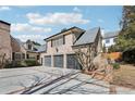 Spacious three-car garage with a brick exterior and ample parking space at 3930 Peachtree Dunwoody Ne Rd, Atlanta, GA 30342