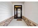 Elegant front door with decorative glass and stone accents, creating a welcoming entrance at 117 Laurel Vw, Canton, GA 30114