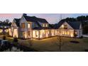 Beautiful two-story home with a connecting structure, detailed trim, and a spacious backyard at 200 Heatherton Way, Milton, GA 30009