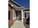 Front entrance with brick and siding, and a walkway at 922 Golden Meadows Ln, Loganville, GA 30052