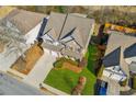 Aerial view of a house with a large front yard, showcasing the property's curb appeal at 4345 Settlers Grove Rd, Cumming, GA 30028