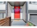 Close-up of front entrance showcasing a vibrant red door and modern hardware at 1230 Worthington Hills Dr, Roswell, GA 30076