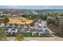 Aerial view of homes at 679 McWilliams Rd SE with surrounding green and brown fields at 679 Mcwilliams Se Rd, Atlanta, GA 30315