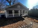 Gray house with white porch and picket fence at 1056 Welch Sw St, Atlanta, GA 30310