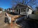 Gray house with white porch and picket fence at 1056 Welch Sw St, Atlanta, GA 30310
