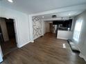 Open living room with kitchen and accent wall at 1056 Welch Sw St, Atlanta, GA 30310