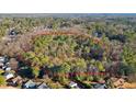 Expansive, wooded lot highlighted with a red border, perfect for a private estate or development opportunity at 550 S Rays Rd, Stone Mountain, GA 30083