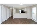 Living room with hardwood floors and view into kitchen at 896 Glynn Oaks Dr, Clarkston, GA 30021