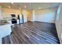 Open concept kitchen with stainless steel appliances and granite counters at 178 Rydal Way, Winder, GA 30268