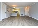 Spacious living room with grey walls and wood-look flooring at 225 Bentley Pl, Tucker, GA 30084