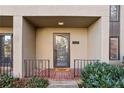 Inviting front door entry with a brick walkway and well-manicured landscaping at 54 Ivy Ne Pkwy, Atlanta, GA 30342