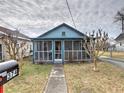 Inviting blue house with a screened porch and walkway at 374 Hawkins St, Marietta, GA 30060