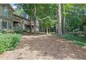 Wooded backyard with pine straw ground cover at 2105 Country Park Dr, Smyrna, GA 30080