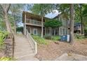 Front view of townhome with stairs and landscaping at 2105 Country Park Dr, Smyrna, GA 30080