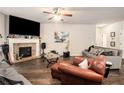 Spacious living room with fireplace and hardwood floors at 220 Seth Ter, Mcdonough, GA 30252