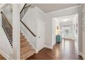 Bright entryway with hardwood floors and staircase at 5750 Sutters Vw, Cumming, GA 30028