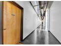 Building hallway with concrete floors and wood doors at 660 Glen Iris Ne Dr # 204, Atlanta, GA 30308