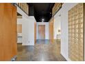 Long hallway with wood doors and glass block accents at 660 Glen Iris Ne Dr # 204, Atlanta, GA 30308