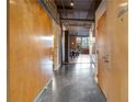 Interior hallway with wood sliding doors and concrete floors at 660 Glen Iris Ne Dr # 204, Atlanta, GA 30308