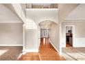 Two-story foyer with hardwood floors and a chandelier at 2812 Havenwood Dr, Conyers, GA 30094