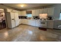 Bright kitchen featuring white cabinets and ample counter space at 331 Overlook Turn Northwest, Conyers, GA 30012