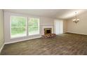 Living room features tile floors, fireplace and neutral colors at 5377 Martins Crossing Rd, Stone Mountain, GA 30088