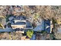 Aerial view of the expansive property showcasing the home's layout and surrounding trees at 1031 Eulalia Ne Rd, Atlanta, GA 30319