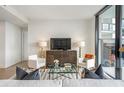 Spacious living room with large windows and modern decor at 2425 Peachtree Road # 1008, Atlanta, GA 30305