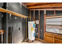 Unfinished basement with water heater and shelving at 108 Woodhaven Dr, Stockbridge, GA 30281