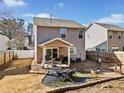 Backyard patio with seating area, fire pit, and gravel landscaping at 151 Nacoochee Way, Canton, GA 30114