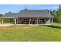 Gray house with covered porch and large yard at 701 Jones Mill Rd, Whitesburg, GA 30185