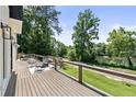 Spacious back deck featuring a cozy seating area and a beautiful river view for outdoor enjoyment at 1010 Edgewater Dr, Atlanta, GA 30328