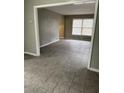 Spacious living room with tile flooring and large windows for plenty of natural light at 1971 Annette Ln, Austell, GA 30106