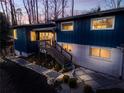 Blue modern home with stylish deck and stone pathway at 1974 Ellwyn Dr, Brookhaven, GA 30341