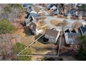 Aerial view showing a house's backyard and surrounding neighborhood at 2013 Parador Bnd, Mcdonough, GA 30253